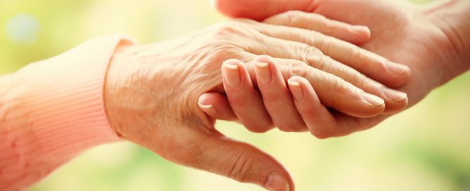 Old and young holding hands
